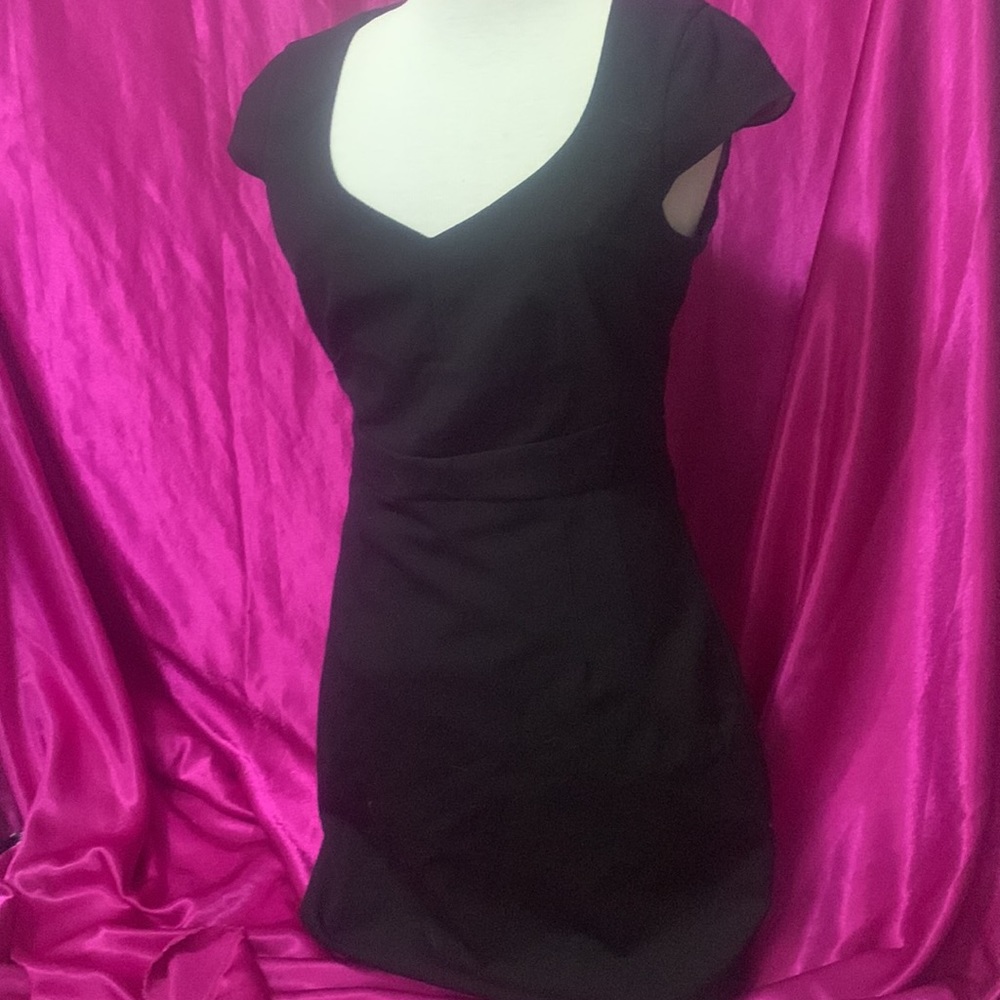 H&M black dress size 8,unique shoulder. Lightly loved. Knee length. Slit